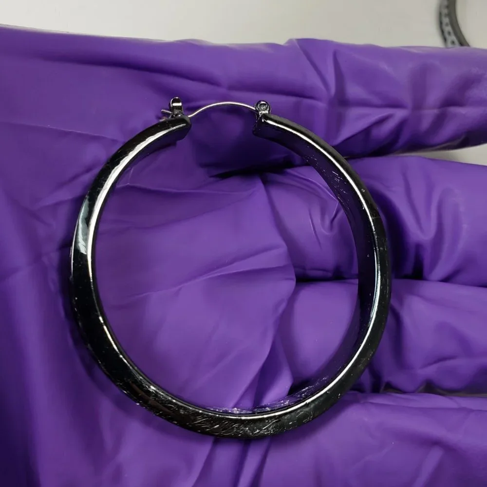 Women's Black Hoop Earrings with Polished Finish and Silver Tone Disc Accents